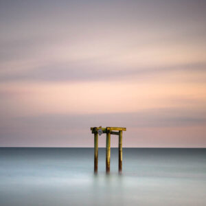 Groin during sunset, a minimalist view created by a long exposure photography technique by Ivo Kerssemakerws